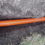 Orange,pvc,sewer,pipes,in,the,ground,,new,pipes,layed